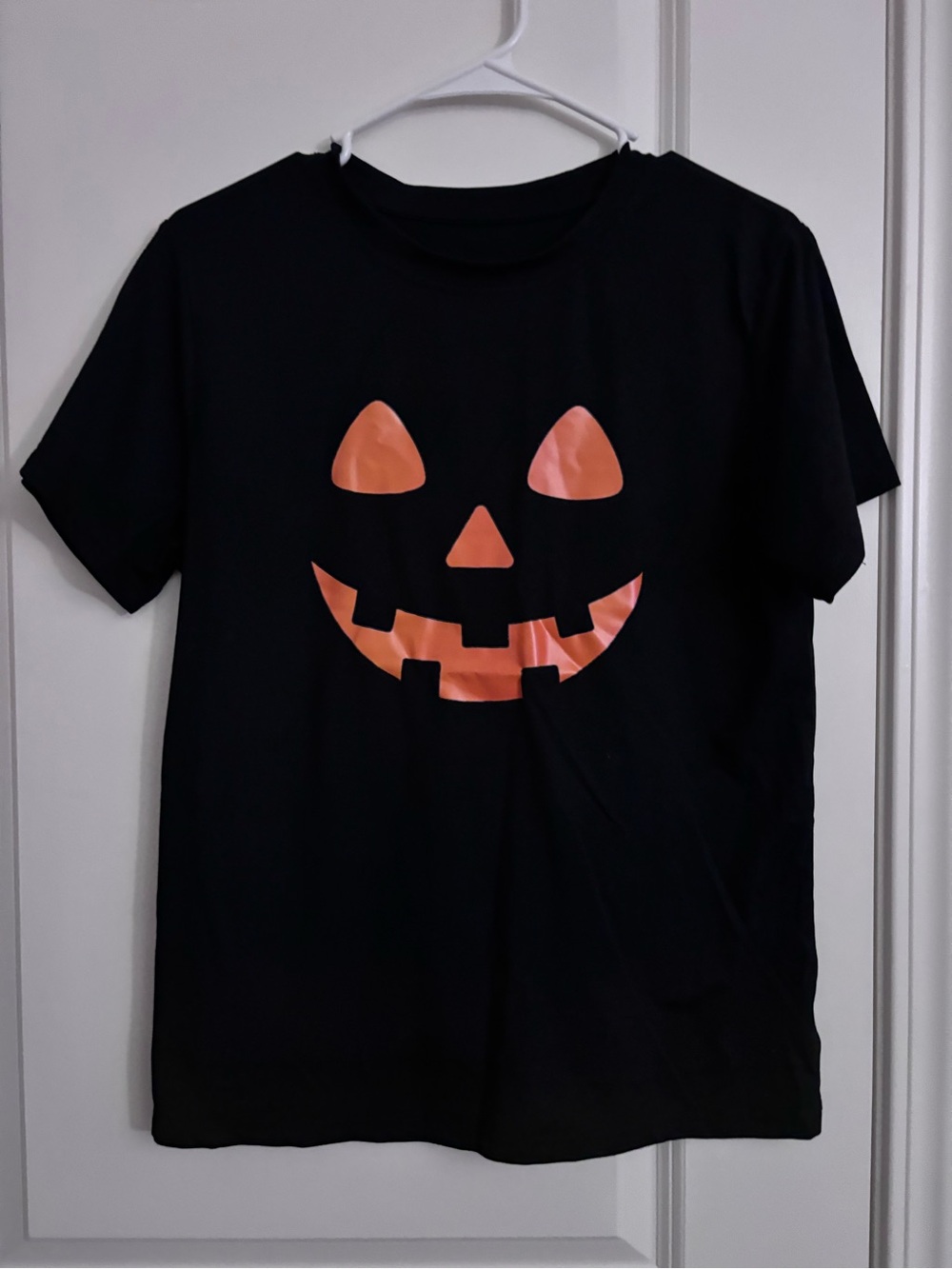 SHEIN Black Tee with Shiny Orange Jack-O'-Lantern Face